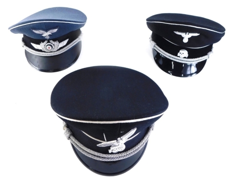 Three various reproduction military peak caps, one with reproduction iron on badge, size 56, etc. (3)