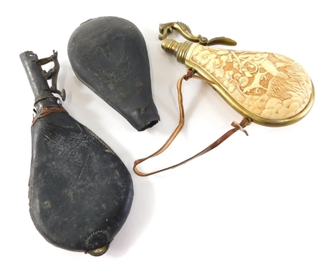 A leather powder flask, of teardrop form, with iron top, 20cm high, a resin and brass powder flask heavily decorated with huntsman and dog in a forest landscape, and a part powder flask raised with hunting scene. (3, AF)