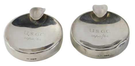 A pair of Elizabeth II silver cigarette stand ashtrays, marked USGC 1960/61, Sheffield 1960. 8cm wide 9.41oz all in. (2)