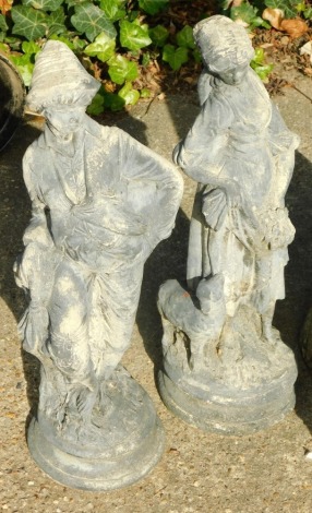 A pair of modern garden statues of a lady and gentleman, 64cm high. (2)