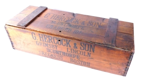 A decorative pine crate, stamped G Hercock & Son Grimsby Lincoln Scunthorpe Skegness Boston, with metal locks and visible dovetails, with side carrying handles, 26cm high, 82cm wide, 30cm deep.