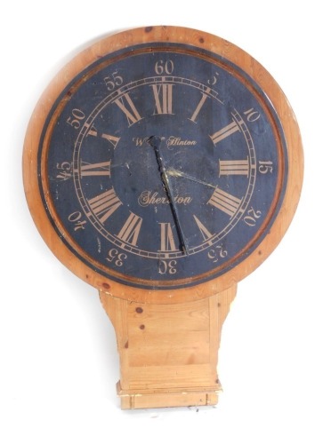 A decorative pine cased drop dial wall clock, the 36cm diameter Roman numeric Arabic dial marked Hinton, 89cm high.