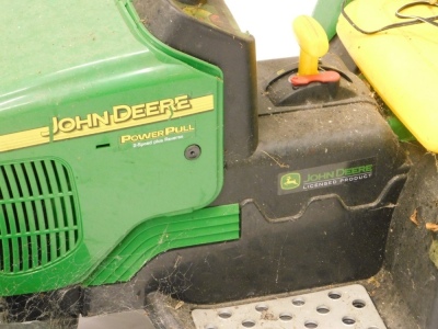 A child's John Deere two speed battery powered tractor, 60cm high, with leads and other accessories. - 2