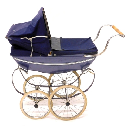 A 20thC Silver Cross dolls pram, with chrome mounts, pine turned handle, two size wheels, adjustable canopy in blue, 82cm high.