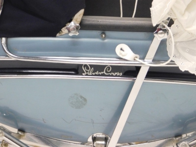 A 20thC Silver Cross pram, with chrome handle, turned grip, adjustable canopy in blue, with chrome frame, two size wheels and basket beneath, 90cm high. - 2