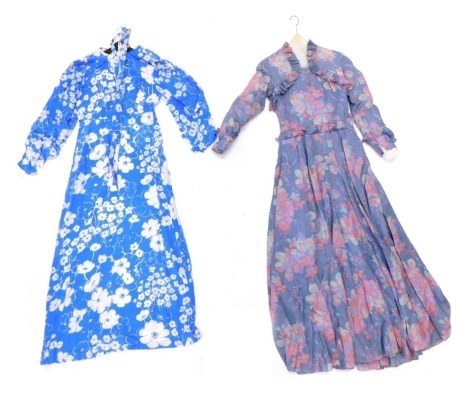 An Ian Thomas ladies vintage dress, in blue and floral pattern with matching belt, and another in vibrant floral pattern. (2)