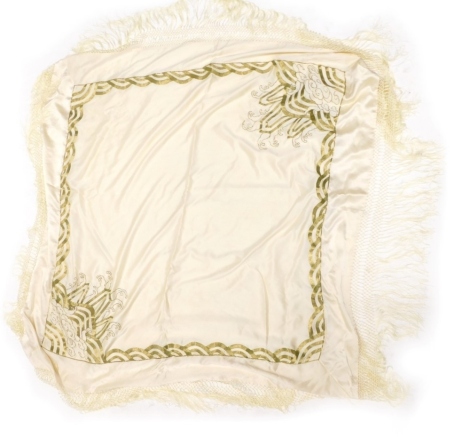 A vintage shawl, in cream with raised decoration.