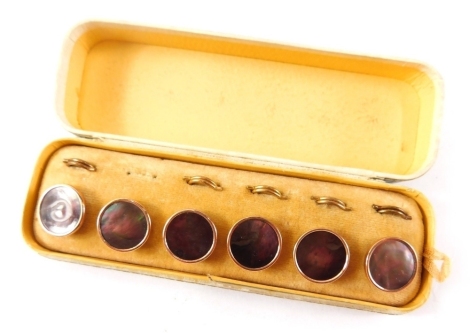 A cased set of gentleman's jewellery, comprising six mother of pearl collar studs, in gold coloured backing, boxed.