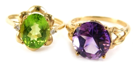 Two 9ct gold dress rings, comprising a peridot and cz set cluster, ring size T, and an amethyst dress ring in basket setting, ring size T½, 6.8g all in. (2)