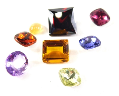 A group of loose gem stones, comprising an oval cut amethyst, a rectangular cut citrine and a square cut garnet, three foil back paste stones and a selective gem orange lustre stone, weighable natural stones 6.8g all in. (a quantity)