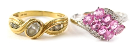 Two dress rings, comprising a 14ct gold cz twist ring, ring size R½, and a 9ct white gold pink topaz and cz dress ring, ring size S, 5.9g all in.