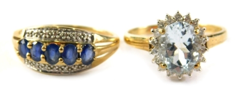 Two 9ct gold dress rings, comprising an aquamarine and cz cluster ring, ring size S½, and a sapphire and diamond dress ring, ring size S½, 6g all in. (2)