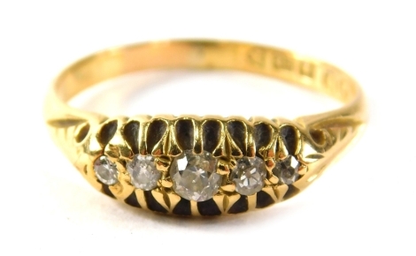 An 18ct gold diamond five stone set dress ring, set with five old cut diamonds, each in a claw setting with scroll design shoulders, ring size Q, 3g all in, boxed.