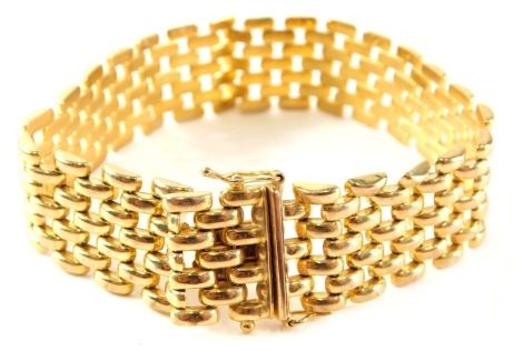 A 9ct gold gate bracelet, of five row design, with side clasp and two safety clips, 21cm long, 19.3g all in.