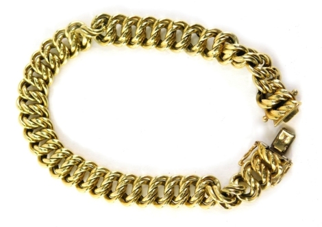 A 14ct gold fancy link bracelet, of two twist link design, 22cm long, 20.3g all in, boxed.