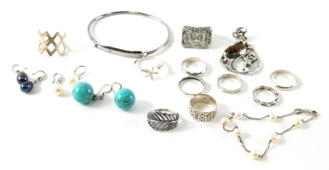 A group of silver and other jewellery, comprising dress rings, bangles, necklaces, etc., amber set floral pendant, turquoise beads, etc. (1 bag)