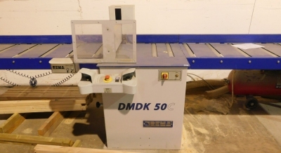 A Rema DMDK-50C cross cut saw with roller platform, the bed being 4.1 metres to the left of the cut and 2.6 metres to the right, including unit block, three phase. VAT is also payable on the hammer price of this lot. - 2