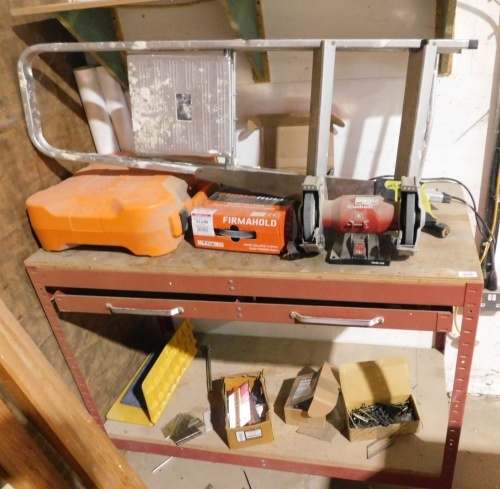 A work bench with grinder, single phase, and various sundries. VAT is also payable on the hammer price of this lot.