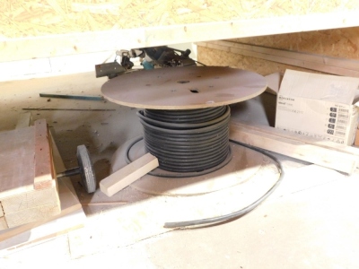 A reel of armored cable and other residual contents under bench. VAT is also payable on the hammer price of this lot.