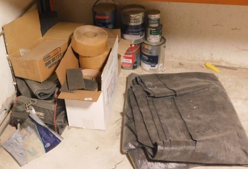 A mixed lot of tarpaulin, tapes, sanding discs and various paints. VAT is also payable on the hammer price of this lot.