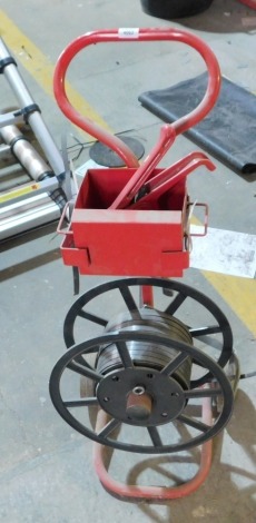 A pallet banding machine. VAT is also payable on the hammer price of this lot.