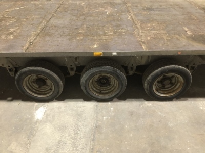 A Ifor Williams three axle low load flat bed trailer, with sides and rear, 2.25m wide, 5.5m long. For Sale by TENDER, final bids to be submitted by 9am Thursday 17th. VAT is also payable on the hammer price of this lot. - 2