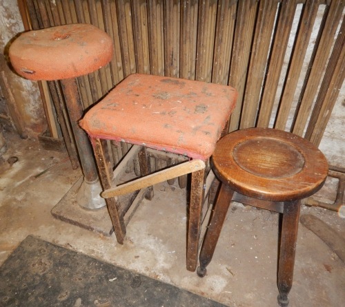 A work bench stool and two others. (3)