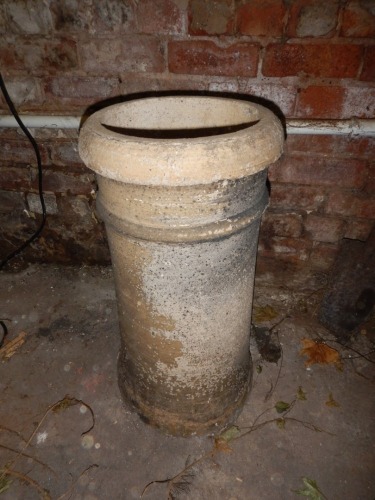 A stoneware chimney pot.