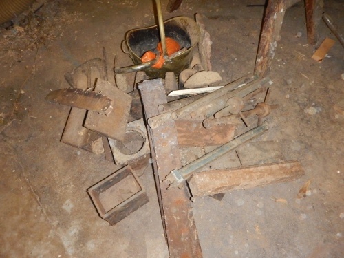 Cast iron weights, shoe lasts, various metalware, etc.