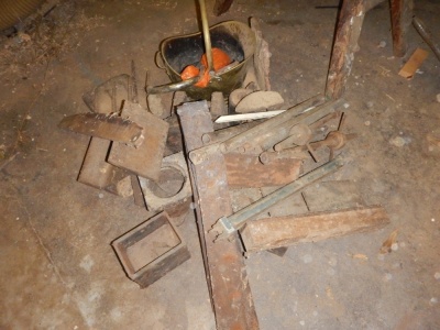 Cast iron weights, shoe lasts, various metalware, etc.