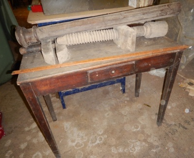 A Georgian oak side table fitted a drawer, wooden vice, etc.