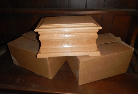 Two light oak funeral caskets.