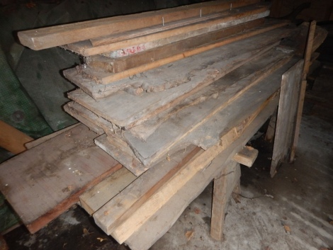 A quantity of similar planks and two trestles.