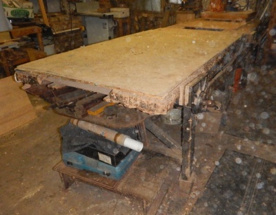 A large Victorian pine work bench, fitted with a drawer, and three Record bench vices, 335cm x 97cm x 92cm high. - 2