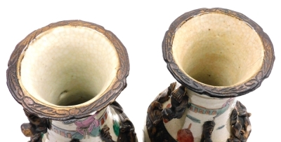 A pair of Chinese crackle glaze vases, of baluster form, with applied dog of fo handles and chilin to the neck, the body depicting a battle scene with figures on horseback, four character mark, 29.5cm high. - 16