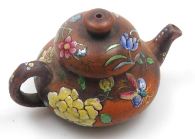 Two miniature teapots, comprising a Chinese Yixing example, decorated in enamels with flowers and butterflies, 4cm high, (AF), and a Japanese Nippon moriage decorated teapot, 5cm high. - 16