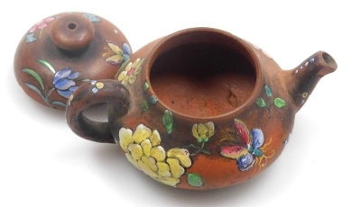 Two miniature teapots, comprising a Chinese Yixing example, decorated in enamels with flowers and butterflies, 4cm high, (AF), and a Japanese Nippon moriage decorated teapot, 5cm high. - 17