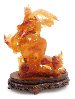 A Chinese agate carving of a vase, enveloped with two dragons and a flaming pearl, terrapin, and a ho-ho bird, raised on a hardwood stand, 21m high, (AF). - 7