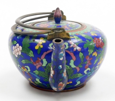 A late 19thC Chinese cloisonne teapot, with double loop brass handle, decorated with flowers and precious objects on a blue ground, 19cm wide. - 10