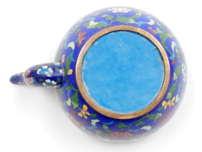 A late 19thC Chinese cloisonne teapot, with double loop brass handle, decorated with flowers and precious objects on a blue ground, 19cm wide. - 14