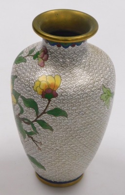 Three items of Chinese cloisonne, comprising a pair of vases and a plate, each decorated with flowers and birds on a white ground, vases 20.5cm high, plate 18cm diameter. - 18