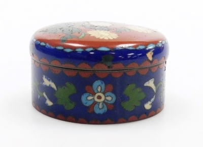 A Japanese Meji period cloisonne enamel koro and cover, of globular form, decorated with flowers, blossom and butterflies on a blue ground, on three bun feet, 10cm wide, together with a Japanese Meiji period cylindrical box and cover decorated with flower - 20