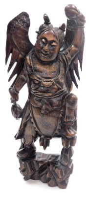 A Balinese hardwood and silver wire inlaid figure, of a Garunda, modelled standing with wings aloft and holding two gourds, 43cm high. - 9