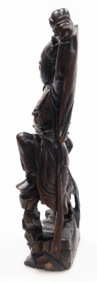 A Balinese hardwood and silver wire inlaid figure, of a Garunda, modelled standing with wings aloft and holding two gourds, 43cm high. - 10