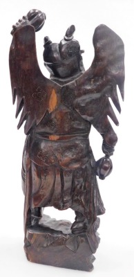 A Balinese hardwood and silver wire inlaid figure, of a Garunda, modelled standing with wings aloft and holding two gourds, 43cm high. - 11