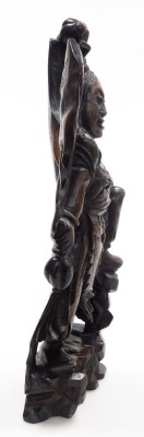 A Balinese hardwood and silver wire inlaid figure, of a Garunda, modelled standing with wings aloft and holding two gourds, 43cm high. - 12