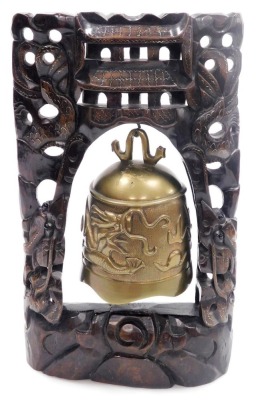 A Chinese brass temple bell, mounted in a hardwood frame with wirework inlay, carved with a pair of dragons, the bell cast with a dragon chasing a flaming pearl, 36cm high. - 8