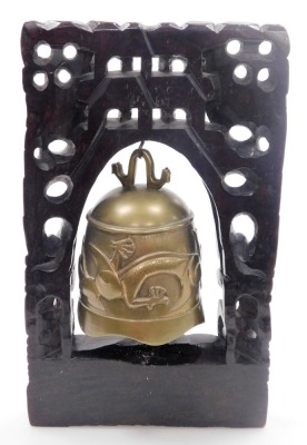 A Chinese brass temple bell, mounted in a hardwood frame with wirework inlay, carved with a pair of dragons, the bell cast with a dragon chasing a flaming pearl, 36cm high. - 9