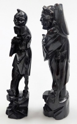 Two Chinese hardwood figures of deities, with silver wirework inlay, 29cm high and 28cm high, and two figures modelled as boys riding on buffaloes, 12cm wide. - 20