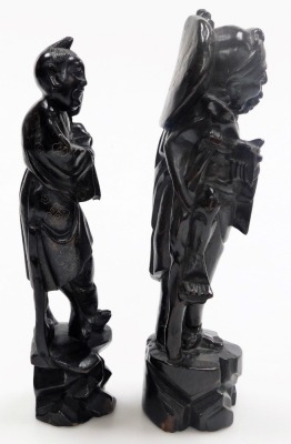 Two Chinese hardwood figures of deities, with silver wirework inlay, 29cm high and 28cm high, and two figures modelled as boys riding on buffaloes, 12cm wide. - 22